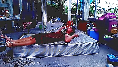 Asian brunette ladyboy enjoys the outdoor by herself